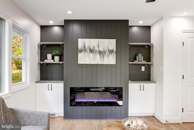 interior space featuring recessed lighting, visible vents, and light wood-style floors