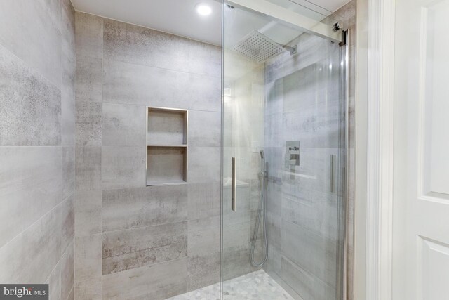 full bath with a shower stall