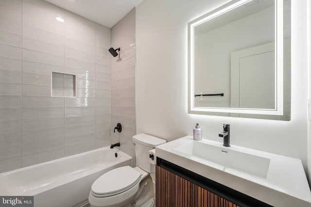 bathroom featuring tub / shower combination, vanity, and toilet