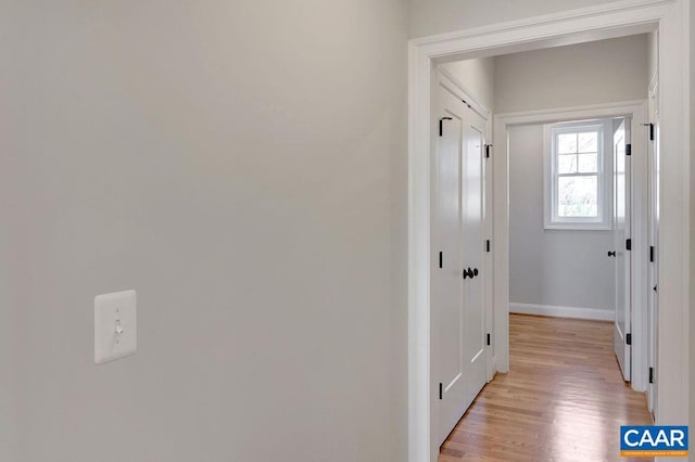 hallway featuring light hardwood / wood-style flooring