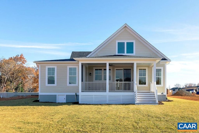 view of front of property with a porch and a front lawn