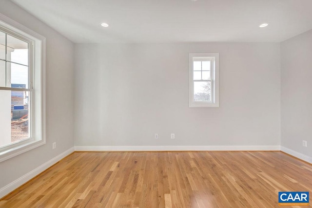 spare room with light wood-type flooring