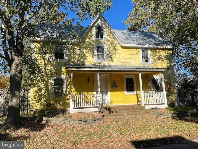 farmhouse inspired home with covered porch