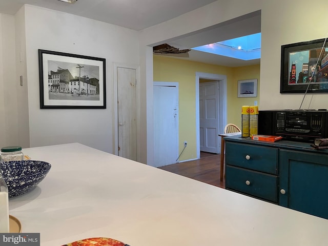 bedroom with dark hardwood / wood-style floors