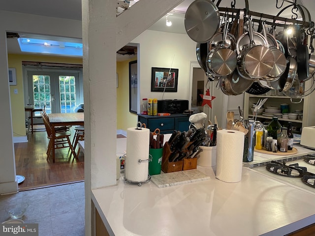 kitchen with french doors and light tile floors