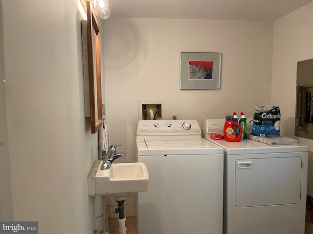 clothes washing area with washer hookup and separate washer and dryer