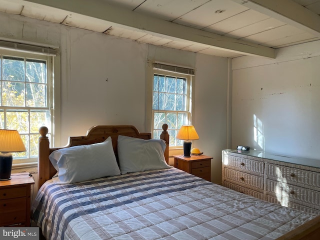 bedroom with beam ceiling