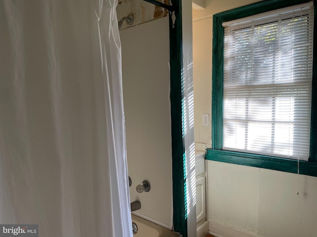 bathroom with shower / bathing tub combination