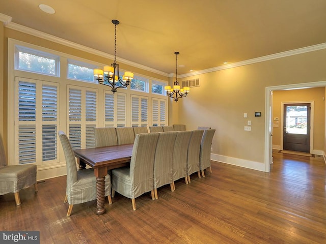 dining area featuring dark wood-type flooring, a notable chandelier, and ornamental molding