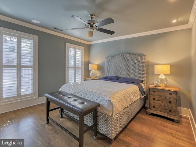 bedroom featuring crown molding, ceiling fan, and dark hardwood / wood-style floors