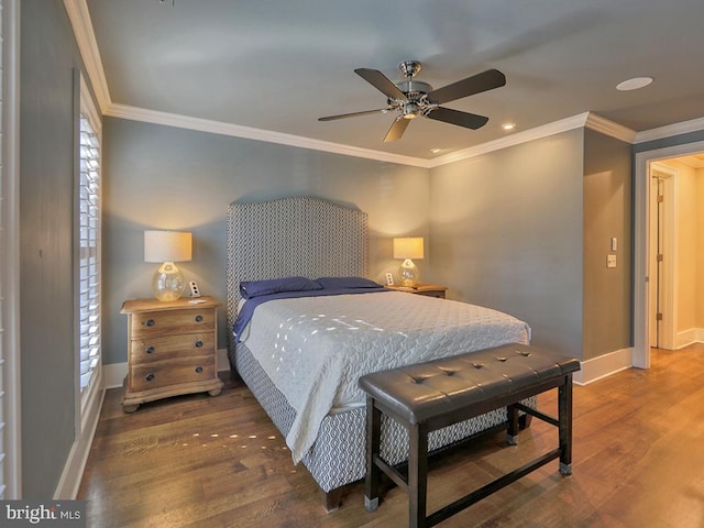 bedroom featuring ceiling fan, dark wood-type flooring, crown molding, and multiple windows