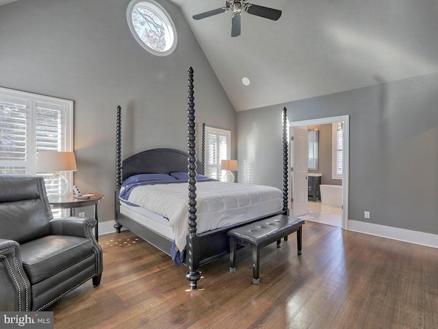 bedroom featuring dark hardwood / wood-style floors, high vaulted ceiling, and multiple windows