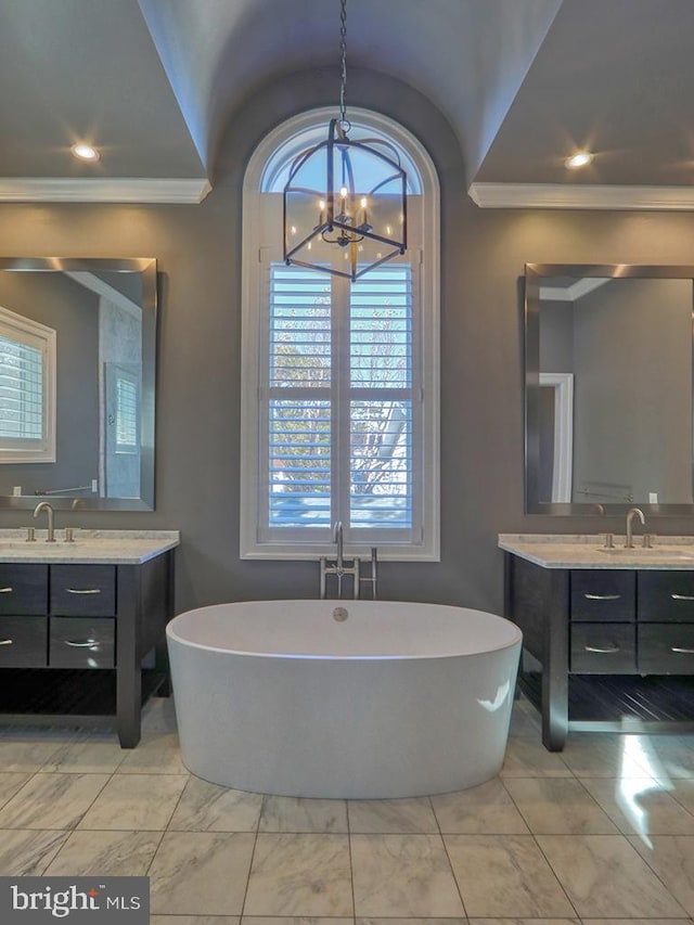 bathroom with ornamental molding, a bathing tub, tile flooring, and a notable chandelier