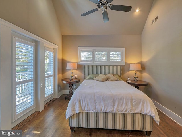 bedroom featuring dark hardwood / wood-style flooring, ceiling fan, access to outside, and vaulted ceiling