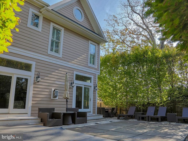 rear view of house with a patio