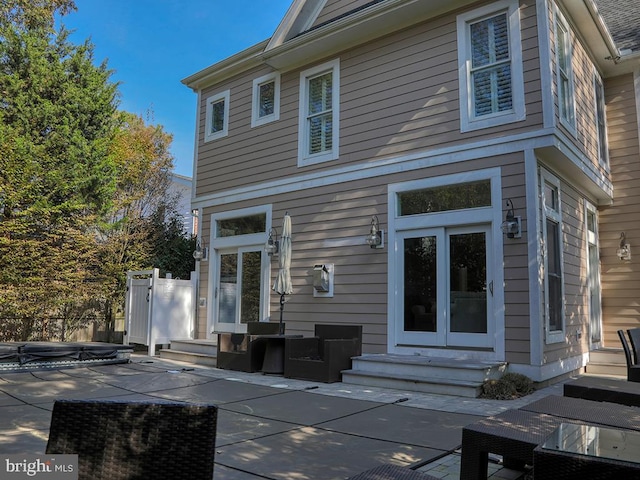 rear view of property featuring a patio