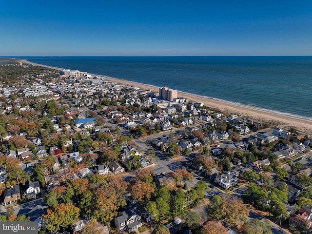 bird's eye view featuring a water view and a view of the beach