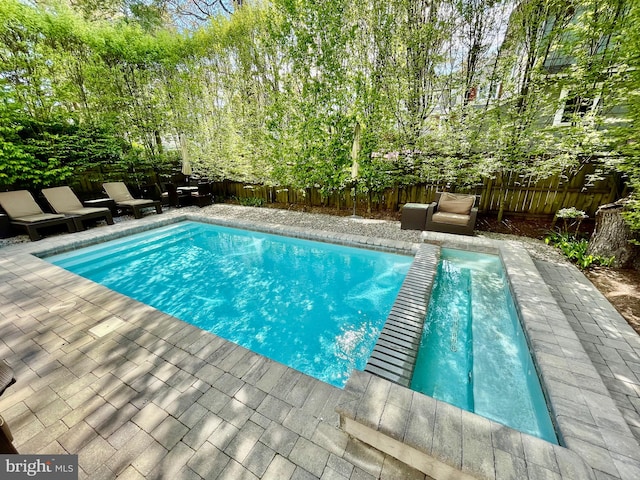 view of pool with a patio area