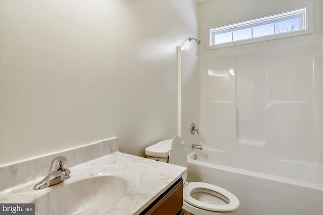 full bathroom with toilet, vanity, and shower / tub combination