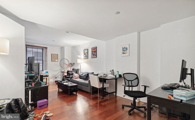 office with dark hardwood / wood-style flooring