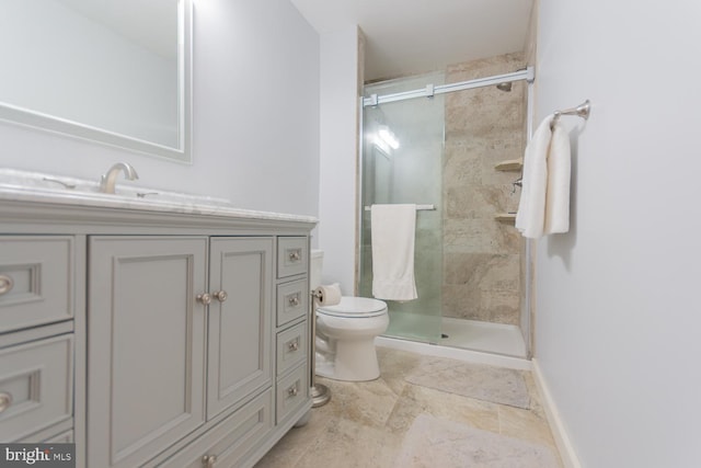 bathroom with toilet, walk in shower, and sink
