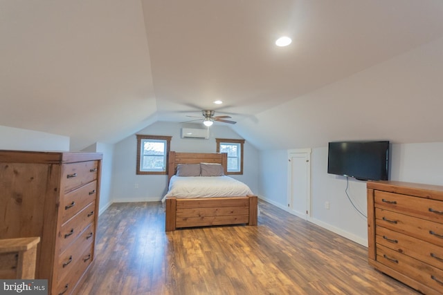bedroom with a wall unit AC, ceiling fan, dark hardwood / wood-style flooring, and vaulted ceiling