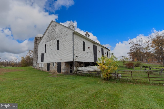 view of home's exterior featuring a yard