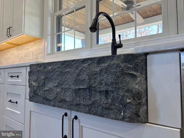 room details with backsplash and ceiling fan