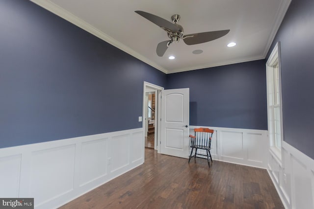spare room with ceiling fan, dark hardwood / wood-style flooring, and ornamental molding