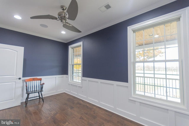 empty room with ceiling fan, dark hardwood / wood-style flooring, and crown molding