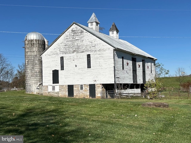 view of side of home featuring a yard