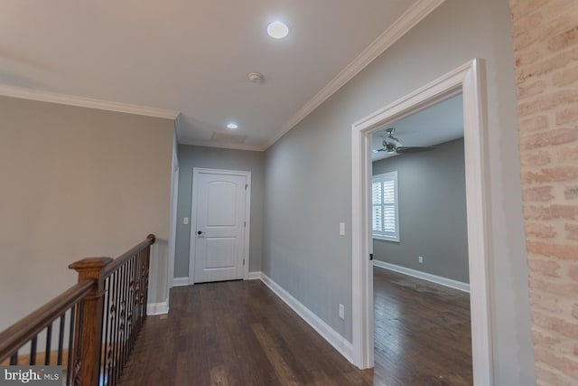 hallway featuring dark hardwood / wood-style floors and ornamental molding