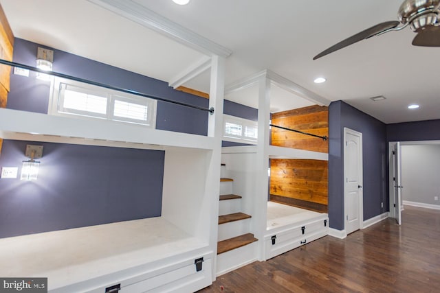 unfurnished bedroom with multiple windows, ceiling fan, and dark hardwood / wood-style flooring