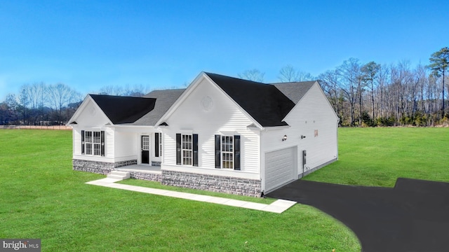 view of front of property featuring a garage and a front yard