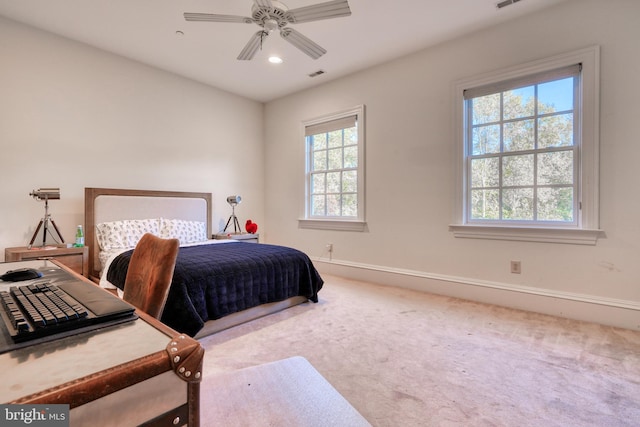 bedroom with ceiling fan and light colored carpet