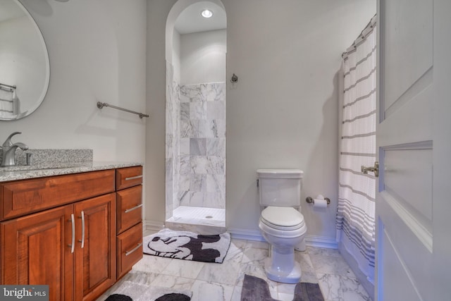 bathroom with vanity, tile flooring, and toilet