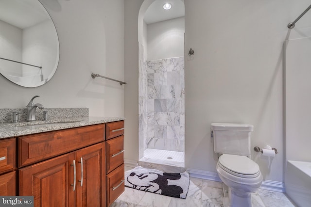 bathroom featuring vanity, toilet, and tile floors