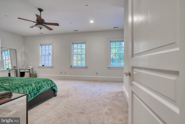 carpeted bedroom featuring ceiling fan