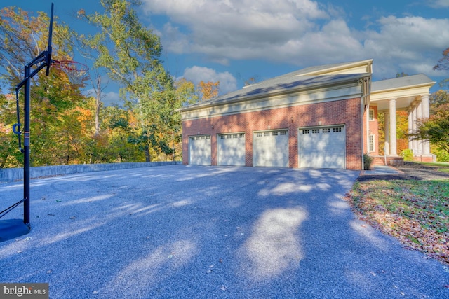 view of side of home featuring a garage