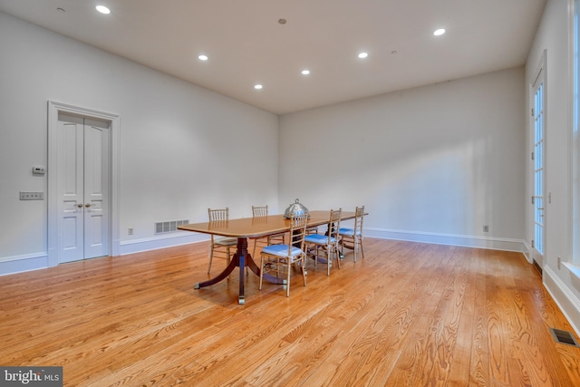 dining area featuring light wood-type flooring