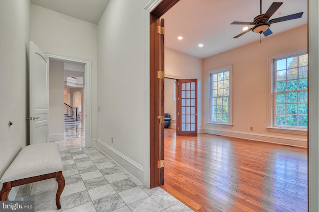 corridor featuring light tile floors