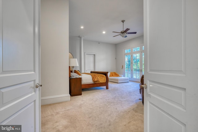 bedroom featuring access to exterior, french doors, and light colored carpet