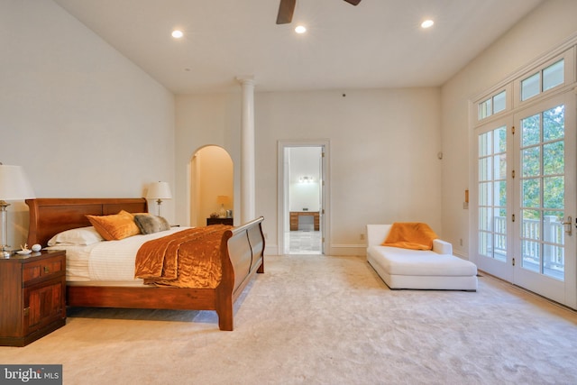 bedroom featuring light colored carpet, access to exterior, ceiling fan, and multiple windows