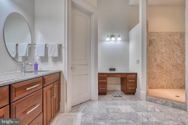 bathroom with vanity and tile flooring