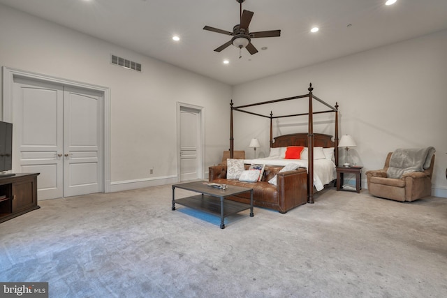 bedroom featuring ceiling fan and light carpet