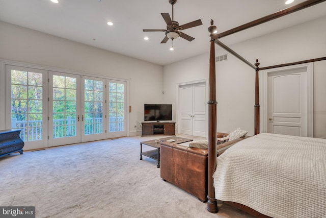 bedroom with light colored carpet, ceiling fan, access to outside, and french doors