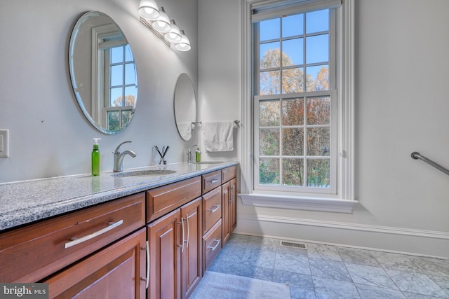 bathroom featuring tile flooring and vanity