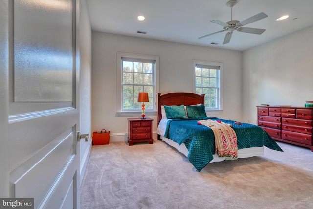 bedroom featuring ceiling fan and light carpet