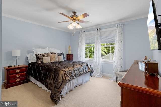 bedroom featuring ceiling fan, light colored carpet, and ornamental molding