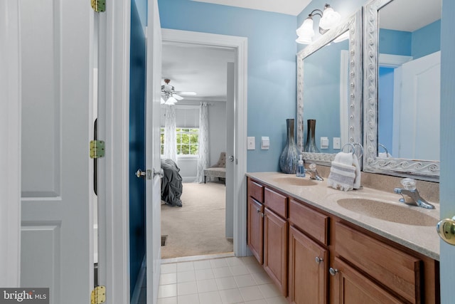 bathroom with tile patterned flooring, ceiling fan, and vanity